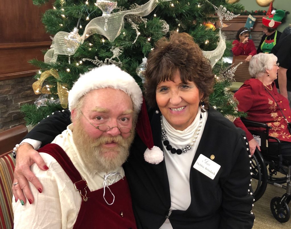 Activities Director Debbie Brindack with Santa