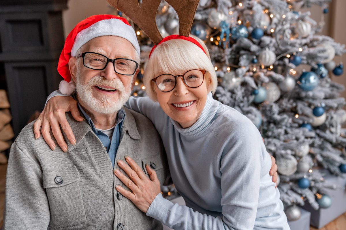 Smiling couple with santa hats