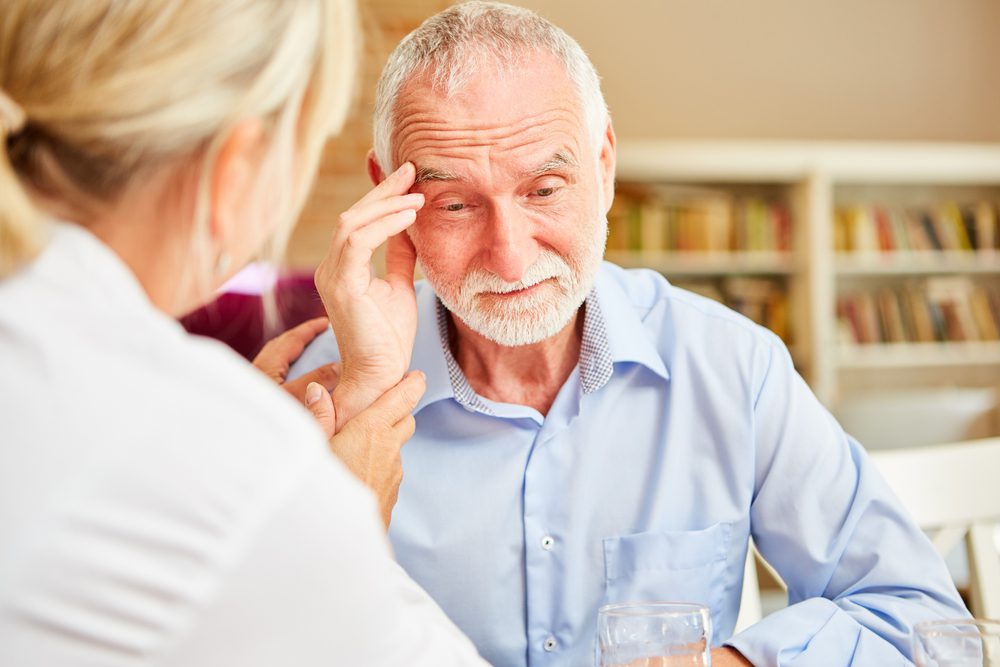 Senior man with caretaker
